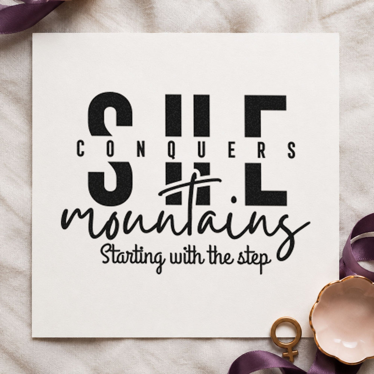 She Conquers Mountains Step craft stamp imprint in black ink on a handmade project, one idea being day pack gift tags.