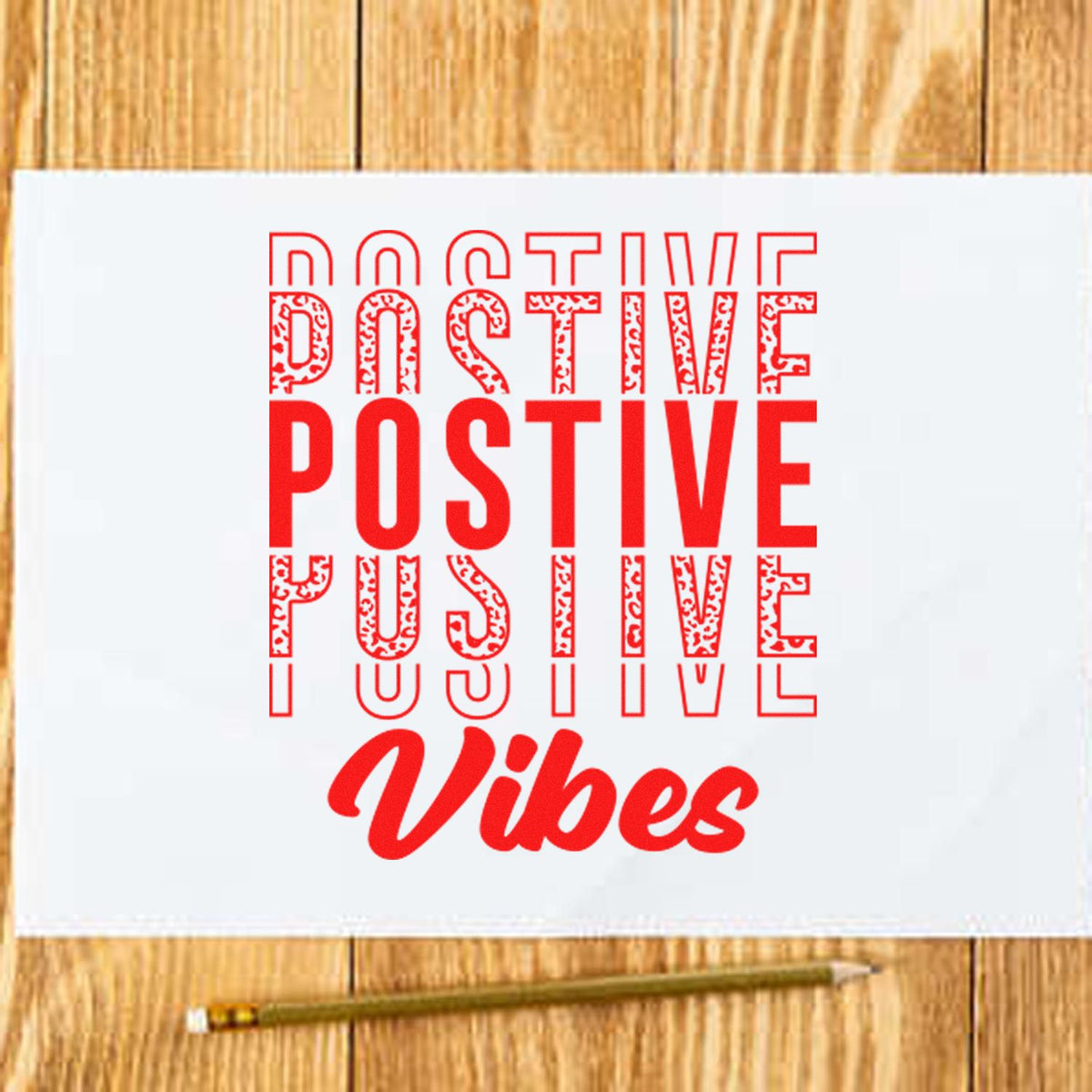 Positive Vibes rubber stamp style graphic in red on paper for handmade cards and craft projects.
