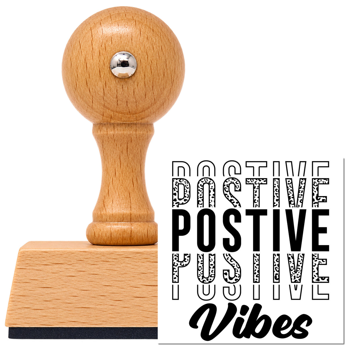 Positive Vibes Repeated Lettering Vintage Pro rubber stamp in European beech wood with a round knob handle, shown beside its black imprint.