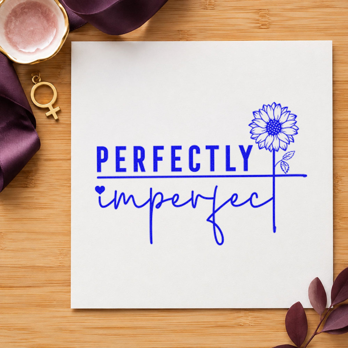 Perfectly Imperfect Sunflower Quote craft stamp in blue ink on cardstock, an easy option for studio apron printing.