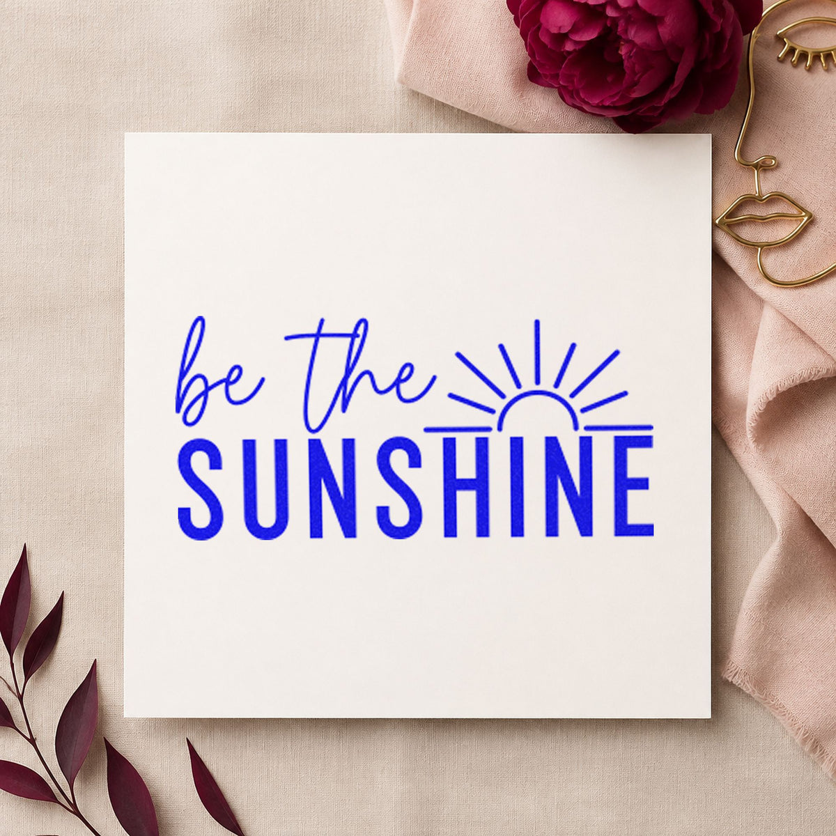 Be The Sunshine Sunrise craft stamp in blue ink on cardstock, an easy option for volunteer cap printing.