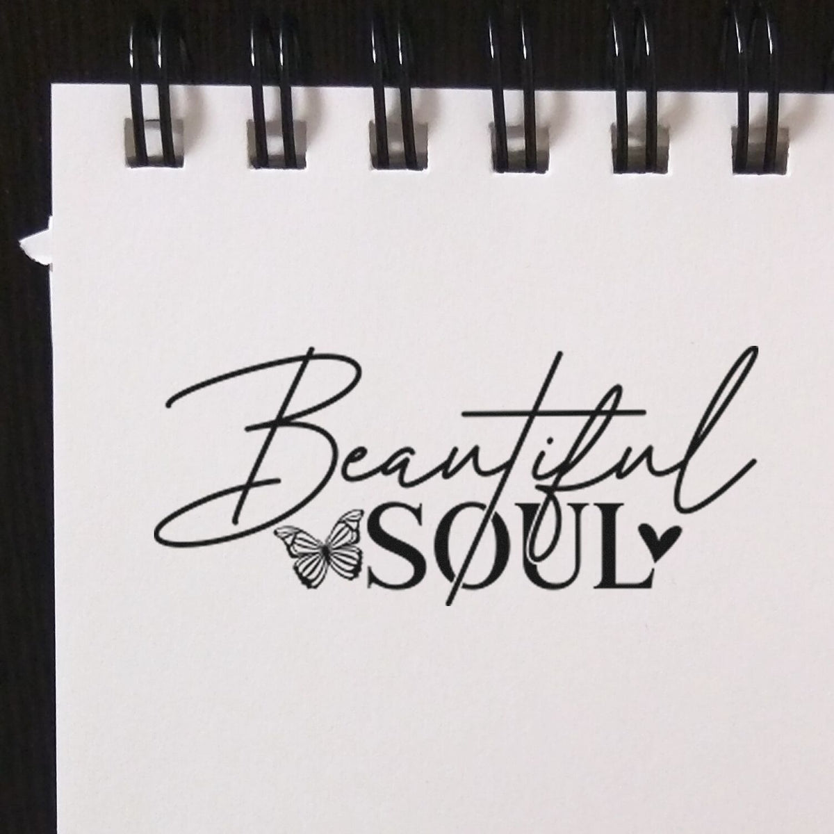 Beautiful Soul Butterfly Lettering Pre-Inked Stamp – PSI imprint stamped in black ink. Beautiful SOUL pairs flowing script with a small butterfly.