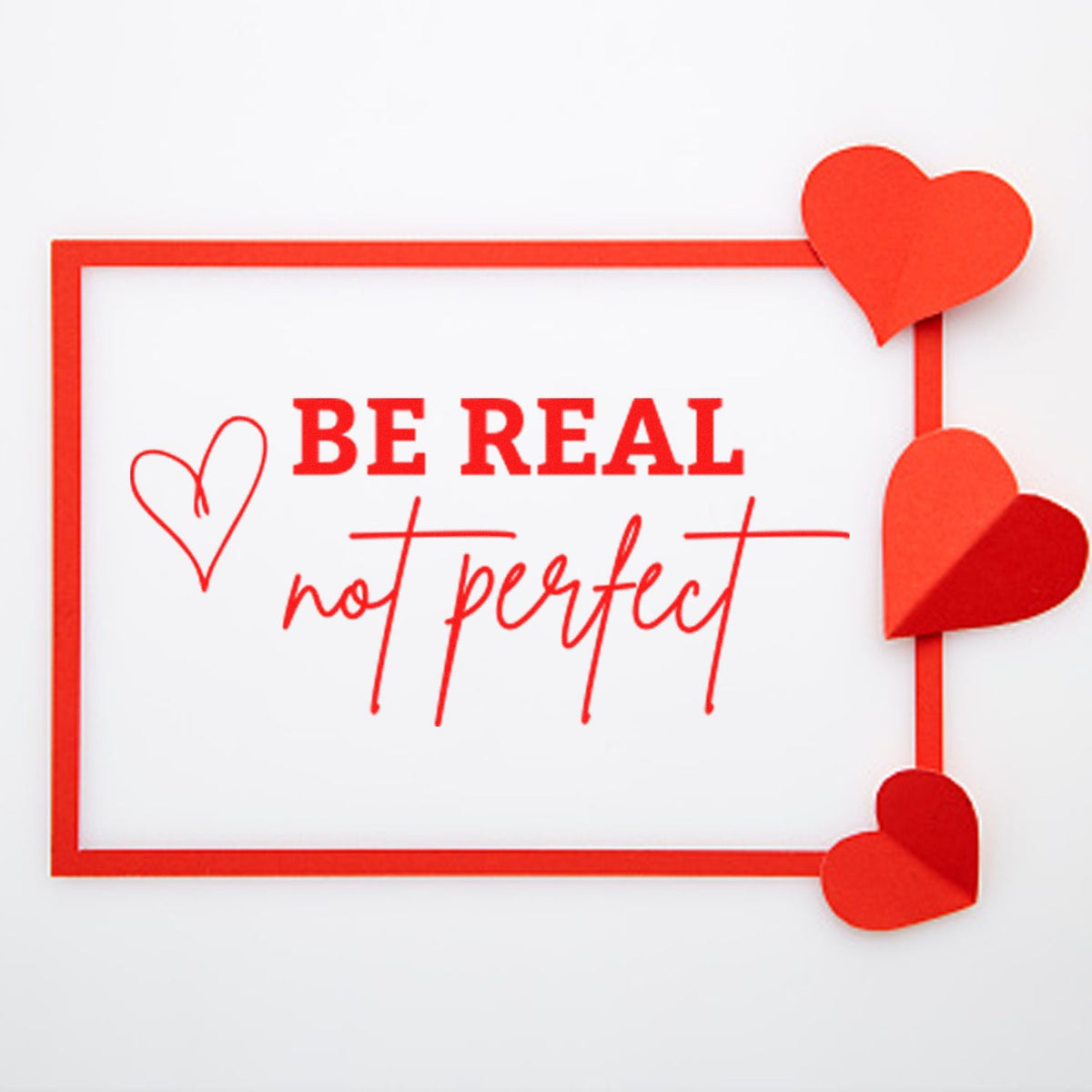 Be Real Not Perfect custom rubber stamp with hearts, red frame, and motivational sentiment for cards, crafts, and stationery.