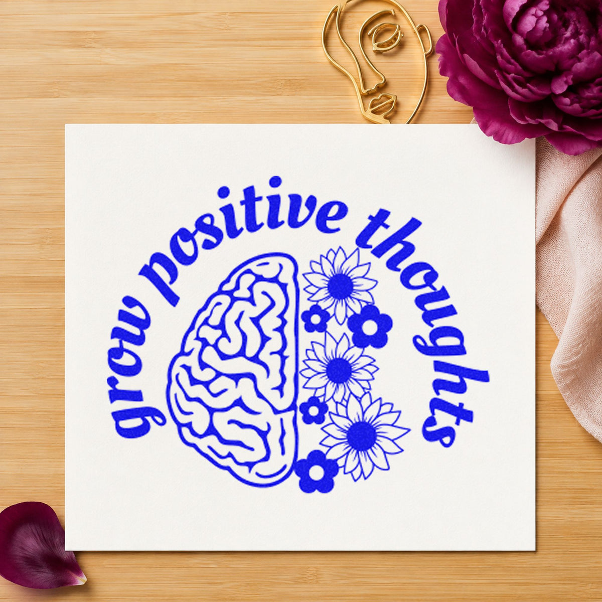 Grow Positive Thoughts Brain craft stamp imprinted in blue ink on paper, a design suited to framed training room.