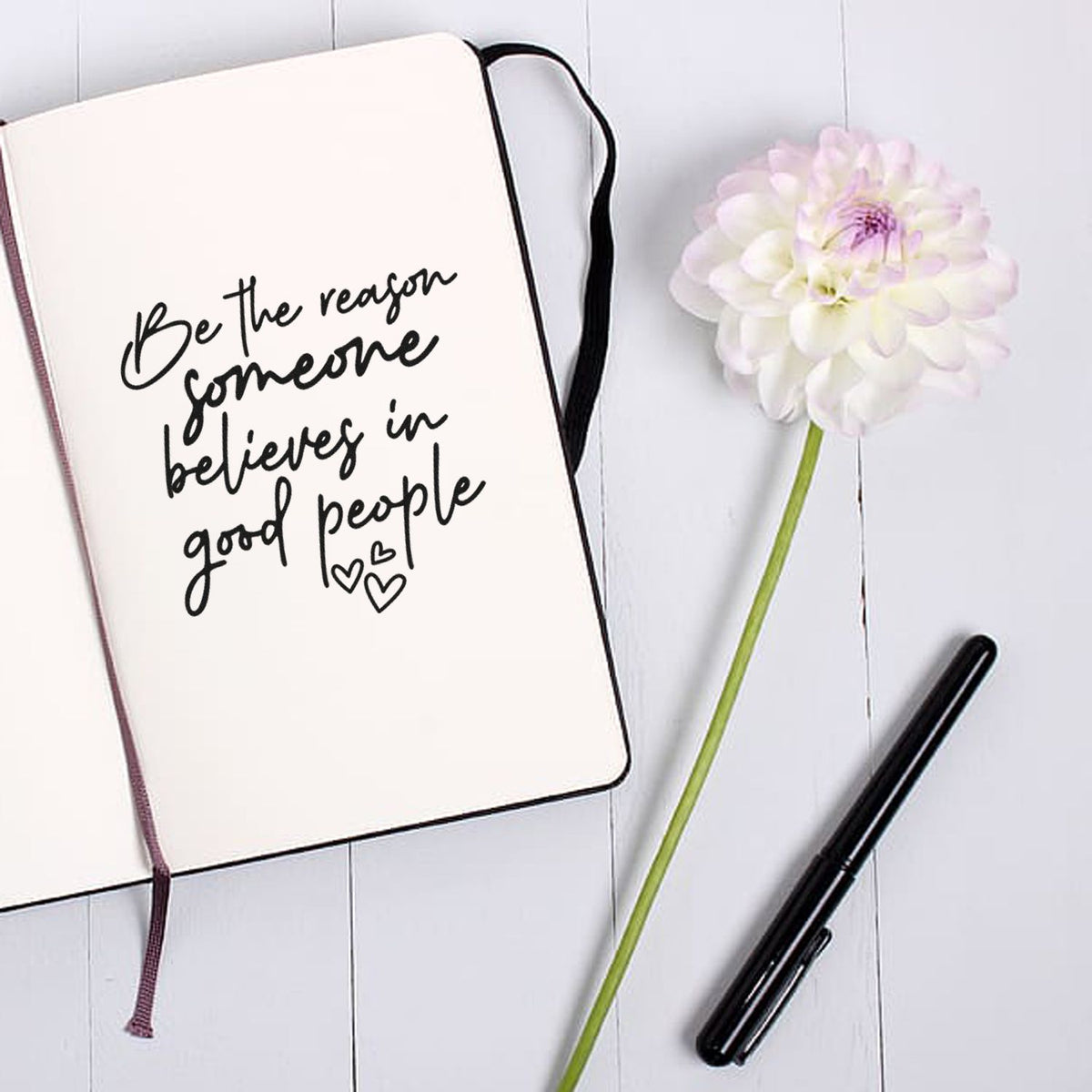 Inspirational rubber stamp quote in notebook for journaling: Be the reason someone believes in good people.