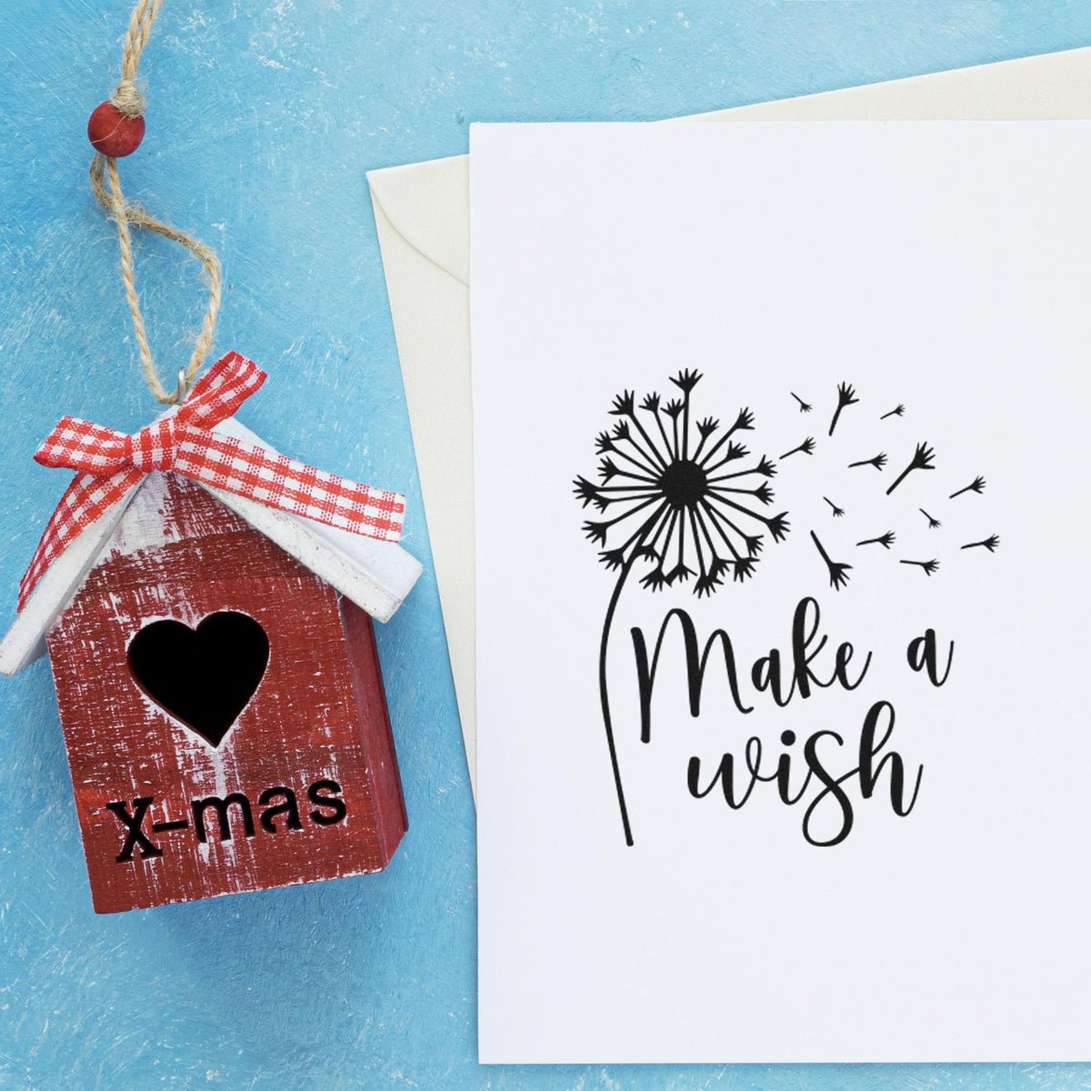 Make A Wish Dandelion Premium Wooden Stamp - Vintage Pro imprint stamped in black ink. Make a wish appears beside a dandelion with seeds blowing to the right.
