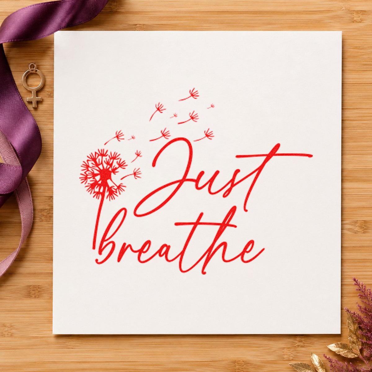 Just Breathe Dandelion Seeds craft stamp imprint in red ink on a handmade project, one idea being dive plan cards.