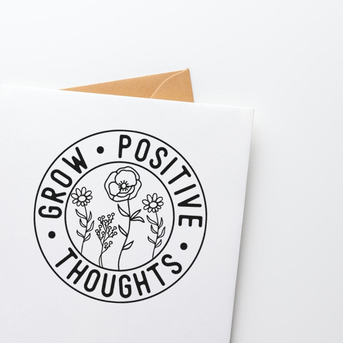 Grow Positive Thoughts floral rubber stamp on a greeting card, ideal for uplifting handmade packaging and craft projects.