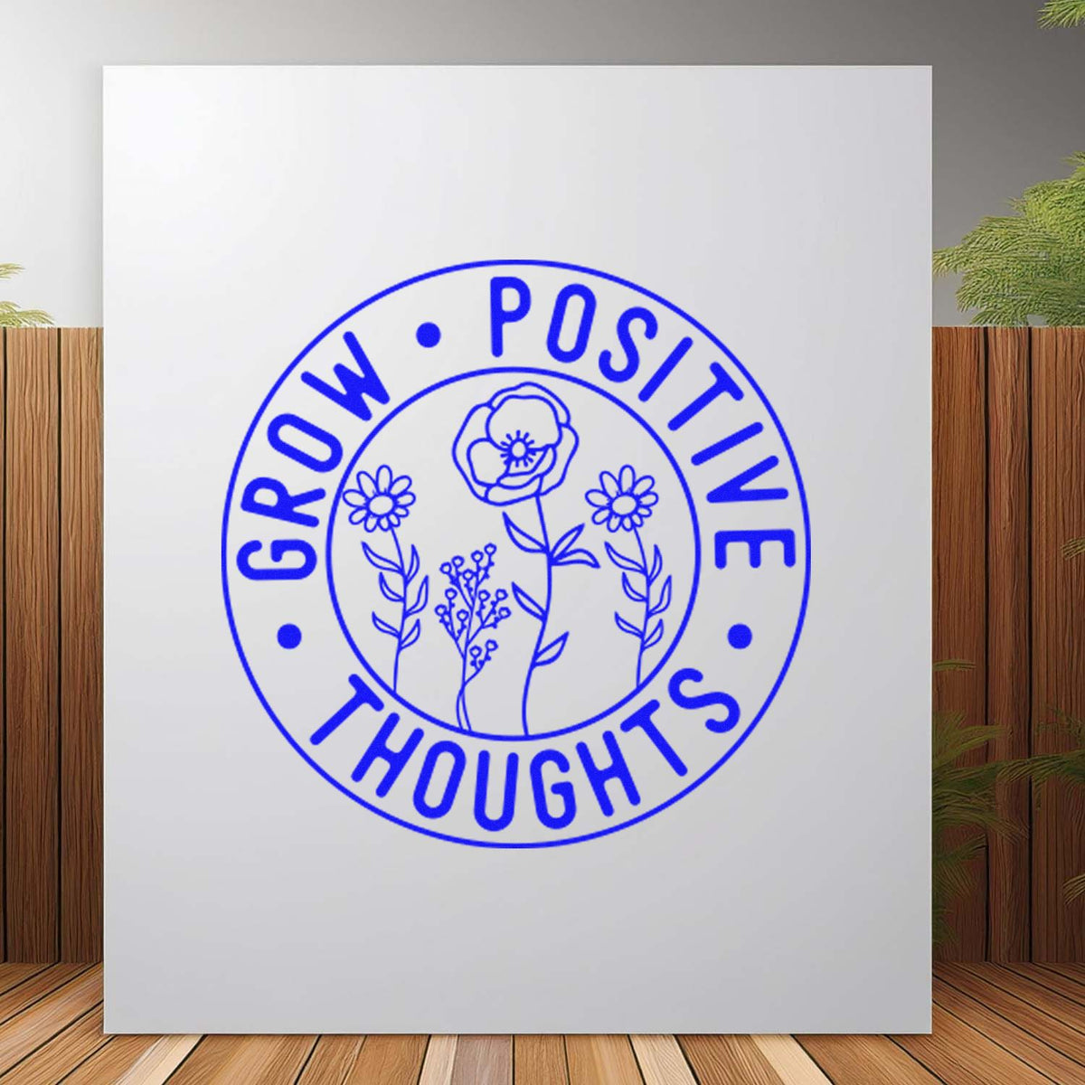 Custom rubber stamp design reading Grow Positive Thoughts with floral circle graphic for inspirational crafts and packaging.