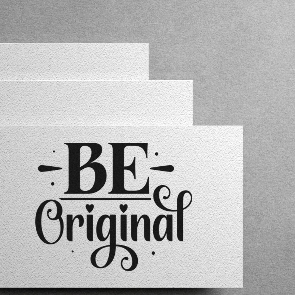 Inspirational Be Original rubber stamp design on textured paper for custom stationery, branding, and craft packaging.