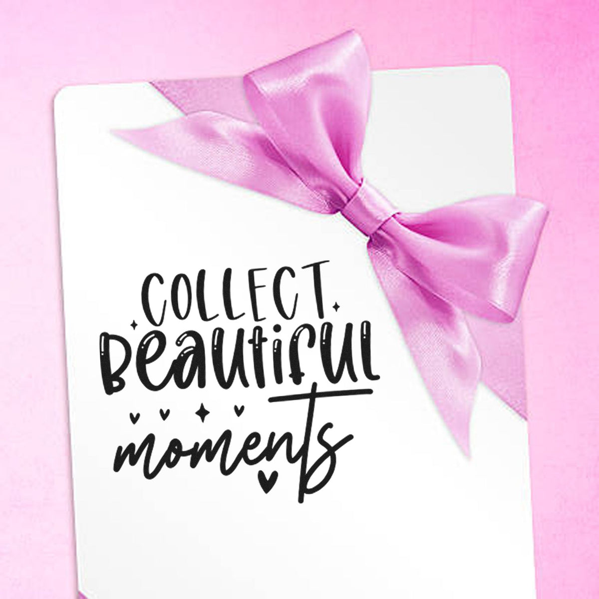 Collect Beautiful Moments rubber stamp design on white card with pink ribbon bow, perfect for scrapbooking and gift tags.