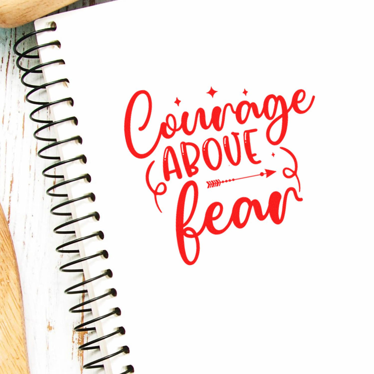 Courage Above Fear rubber stamp design in red, ideal for journaling, scrapbooking, and inspirational craft projects.