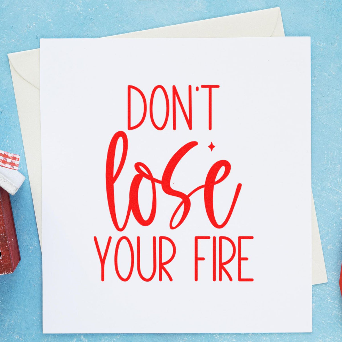 Motivational rubber stamp design reading Dont lose your fire on a white card for handmade stationery.