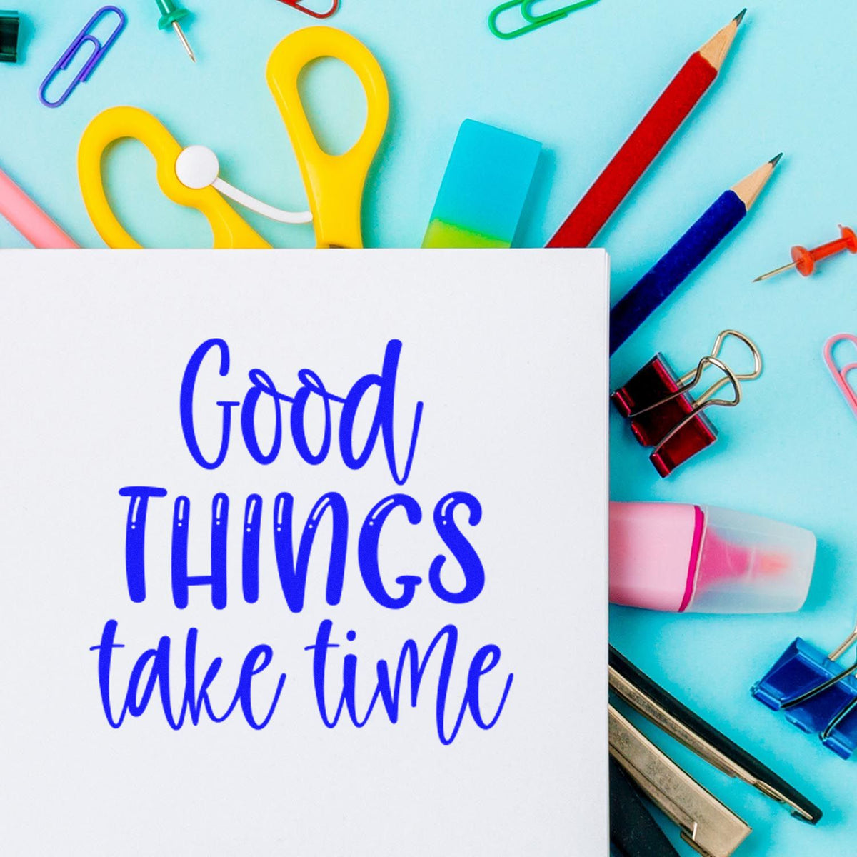 Custom motivational rubber stamp design reading Good things take time with colorful stationery on a blue background.