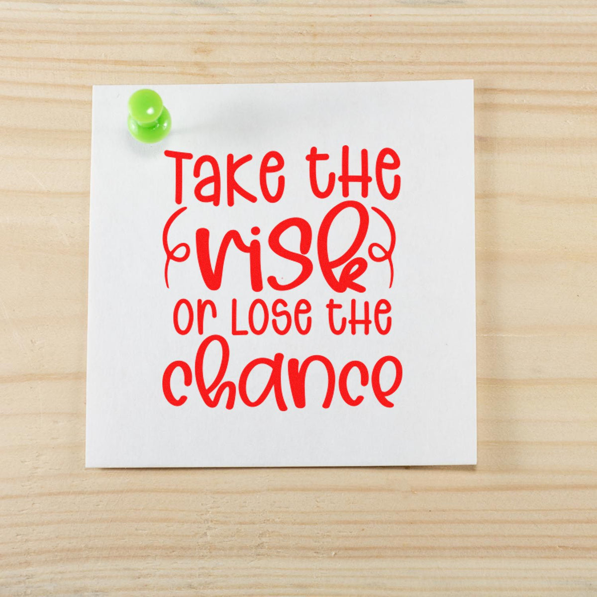 Inspirational rubber stamp design with quote Take the risk or lose the chance for bold motivational messaging.