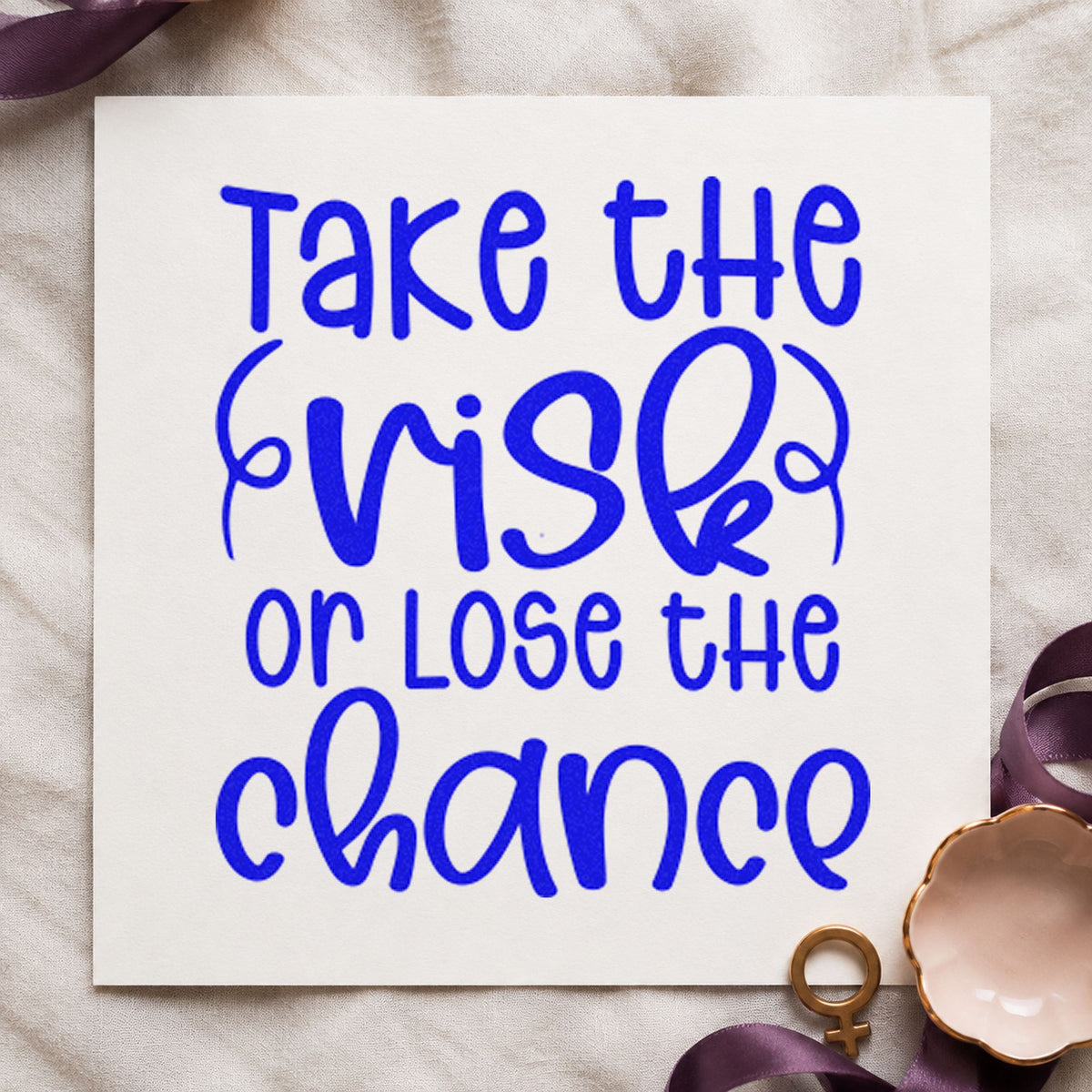 Take The Risk Quote craft stamp imprinted in blue ink on paper, a design suited to framed writing corner.