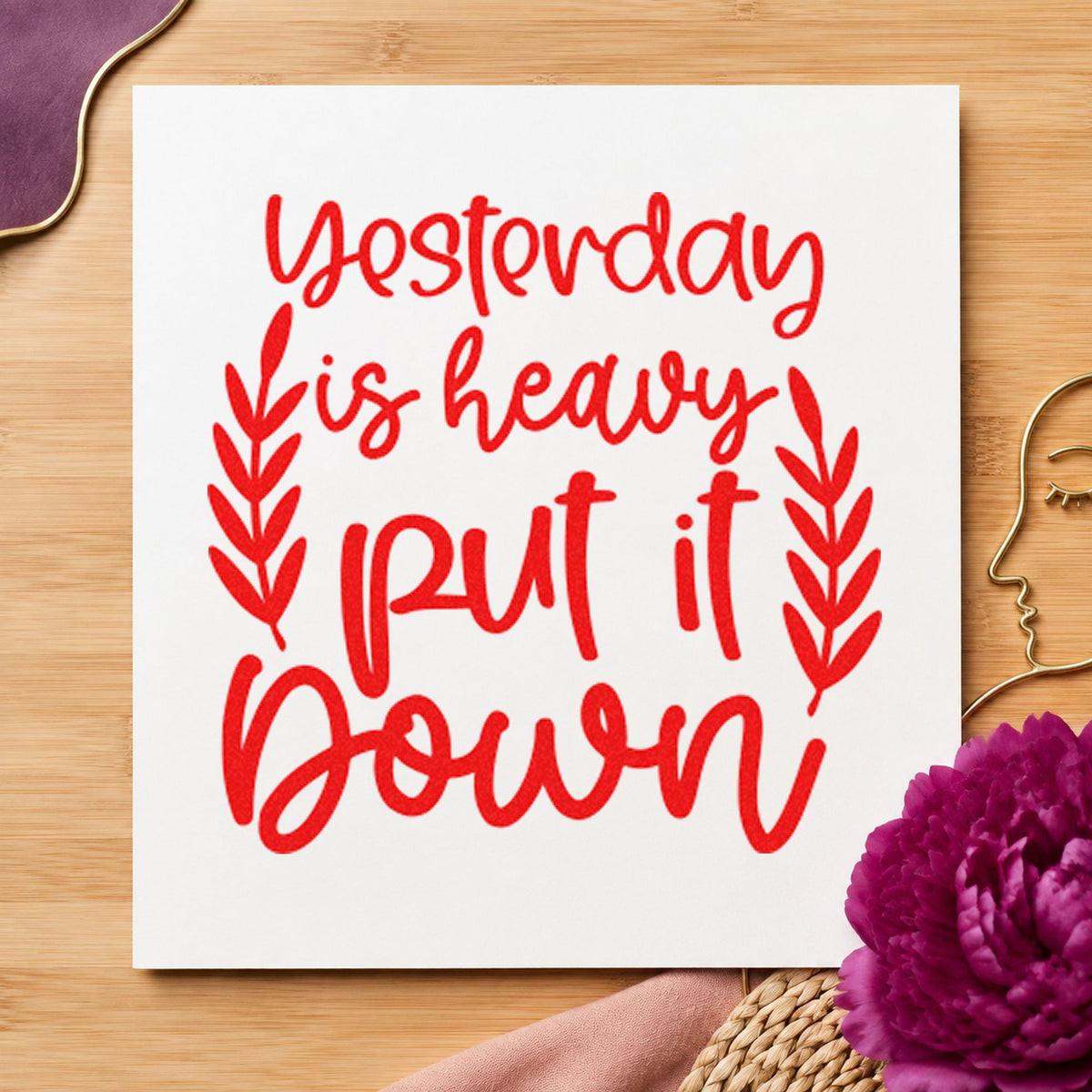 Yesterday Heavy Put Down craft stamp imprint in red ink on a handmade project, one idea being room done cards.