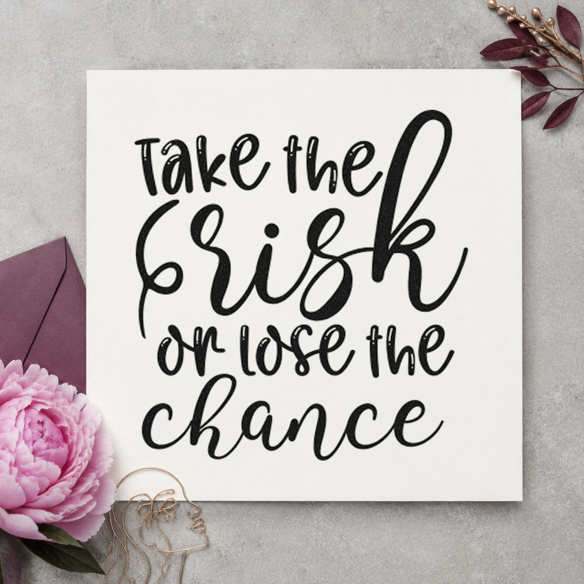 Take Risk Lose Chance craft stamp imprint in black ink on a handmade project, one idea being take home gift tags.