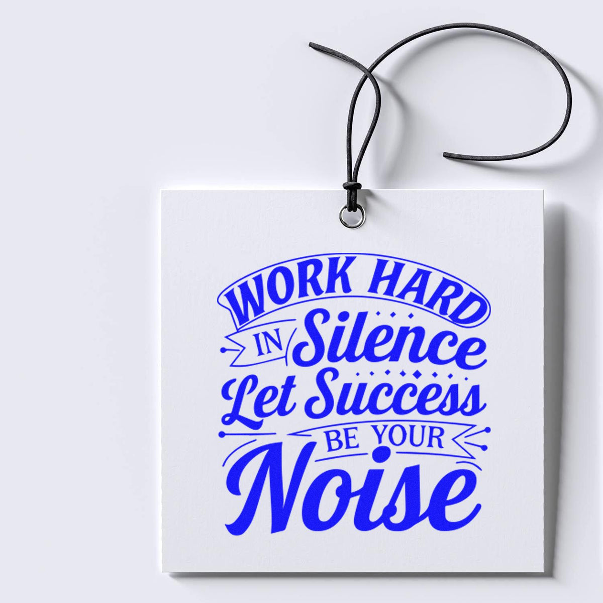 Motivational rubber stamp design with blue quote: Work Hard in Silence, Let Success Be Your Noise on a hanging tag.