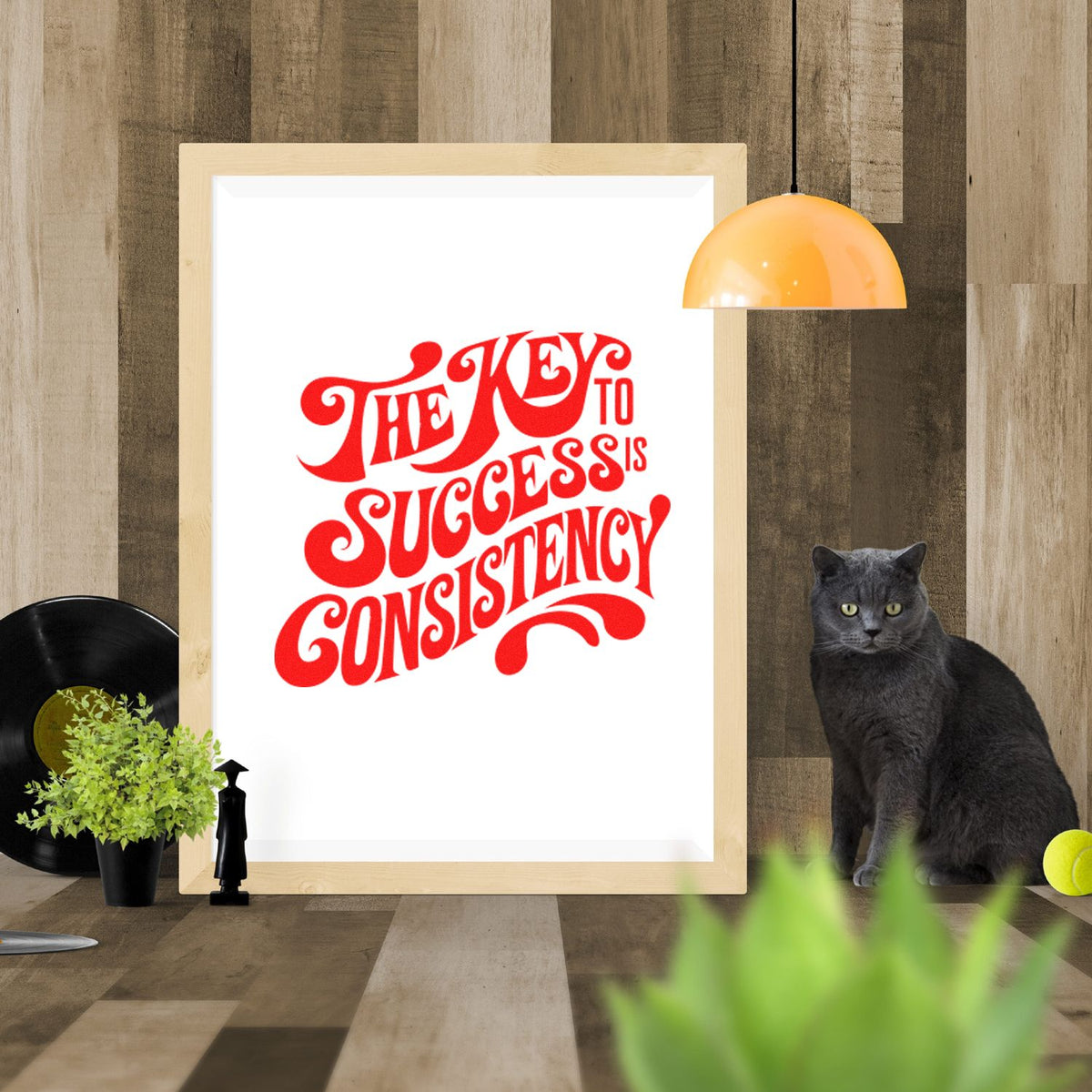 Motivational rubber stamp design reading The key to success is consistency in bold red vintage lettering.