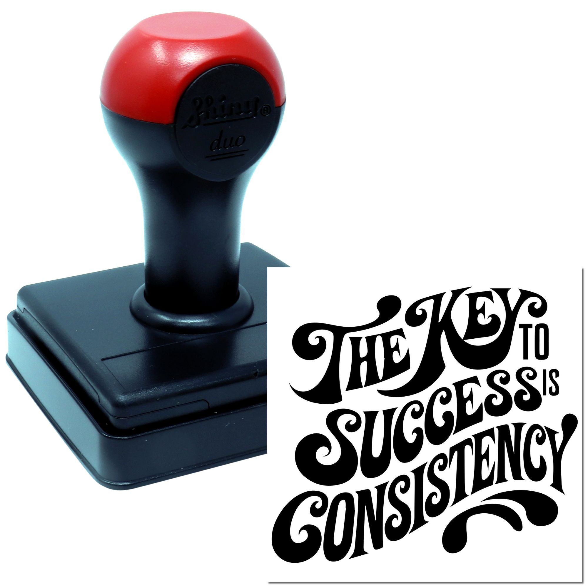 Custom self-inking rubber stamp featuring the quote The key to success is consistency in bold decorative lettering.
