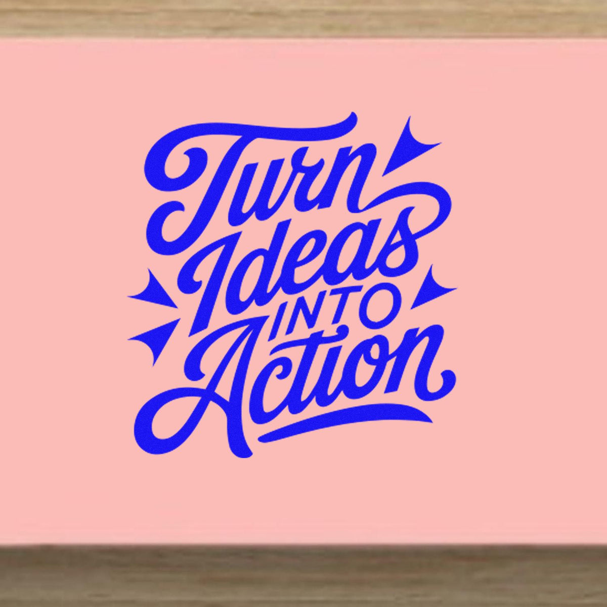 Turn Ideas Into Action rubber stamp design with bold blue script lettering, ideal for motivational branding and craft projects.