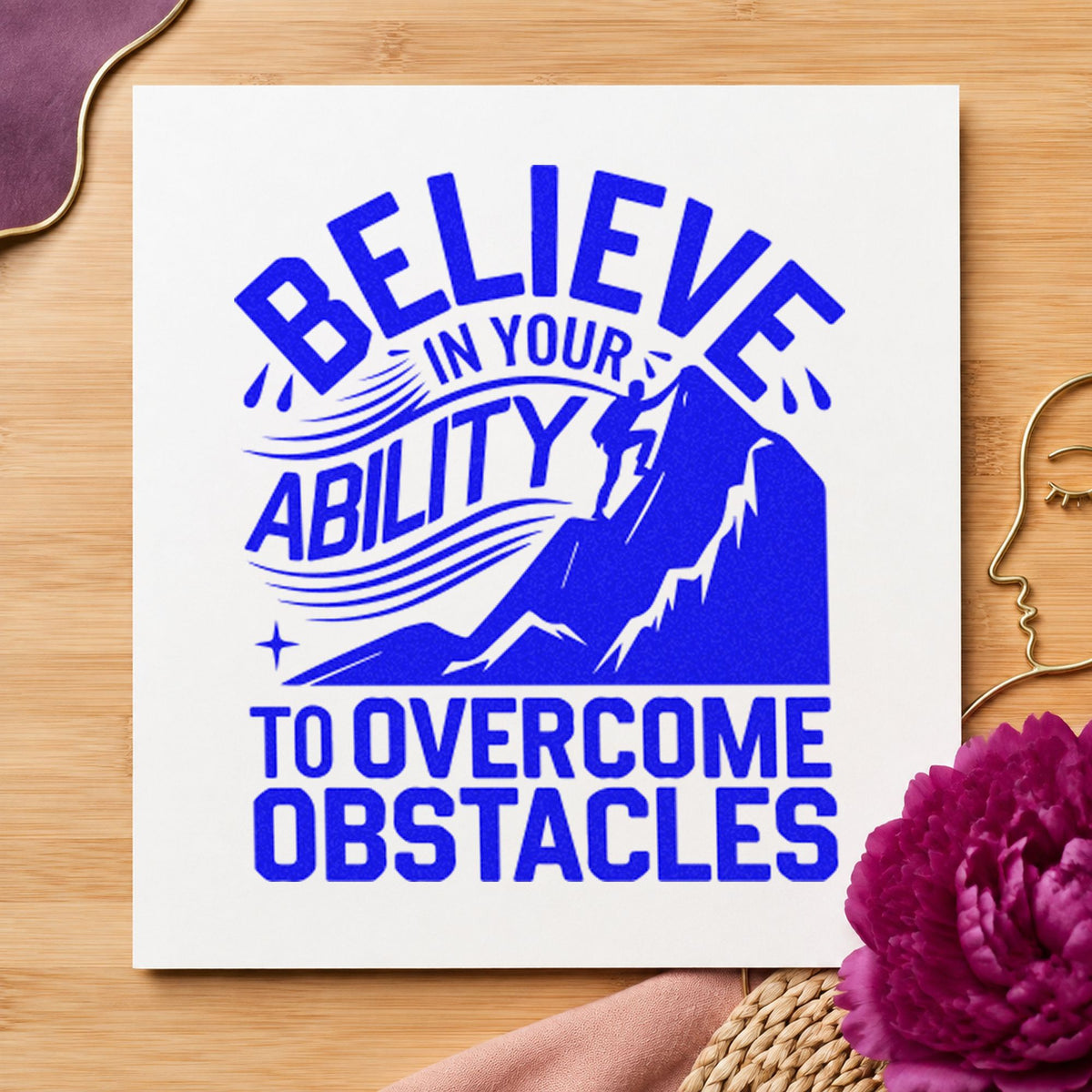 Believe Ability Overcome Obstacles craft stamp in blue ink on cardstock, an easy option for belay glove printing.