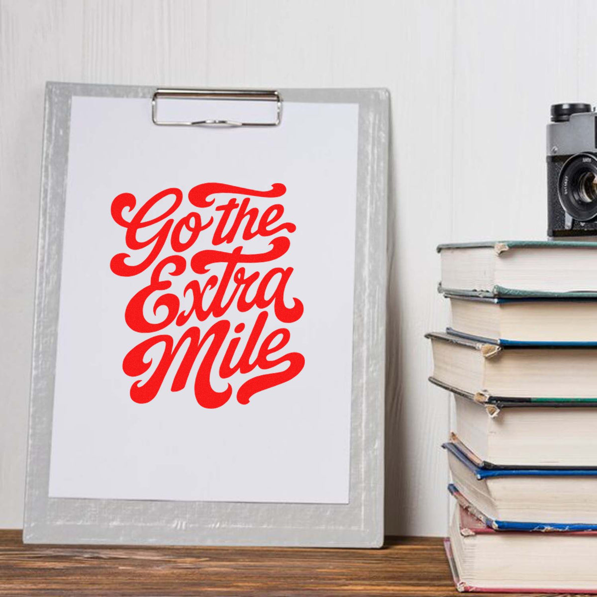 Go the Extra Mile rubber stamp design in bold red script, perfect for motivational office or classroom stamping.