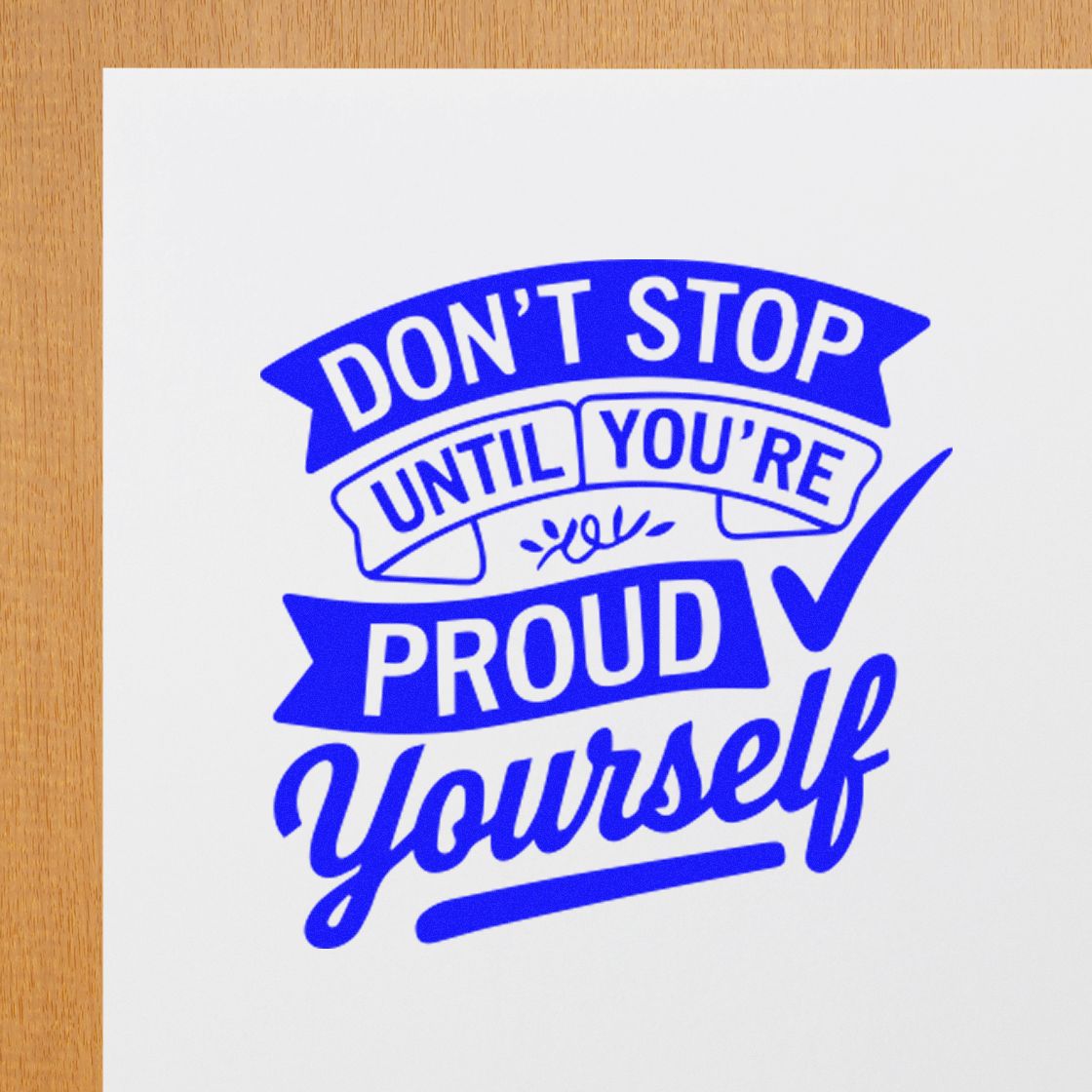 Blue motivational rubber stamp design with quote: Dont Stop Until Youre Proud Yourself and a check mark.