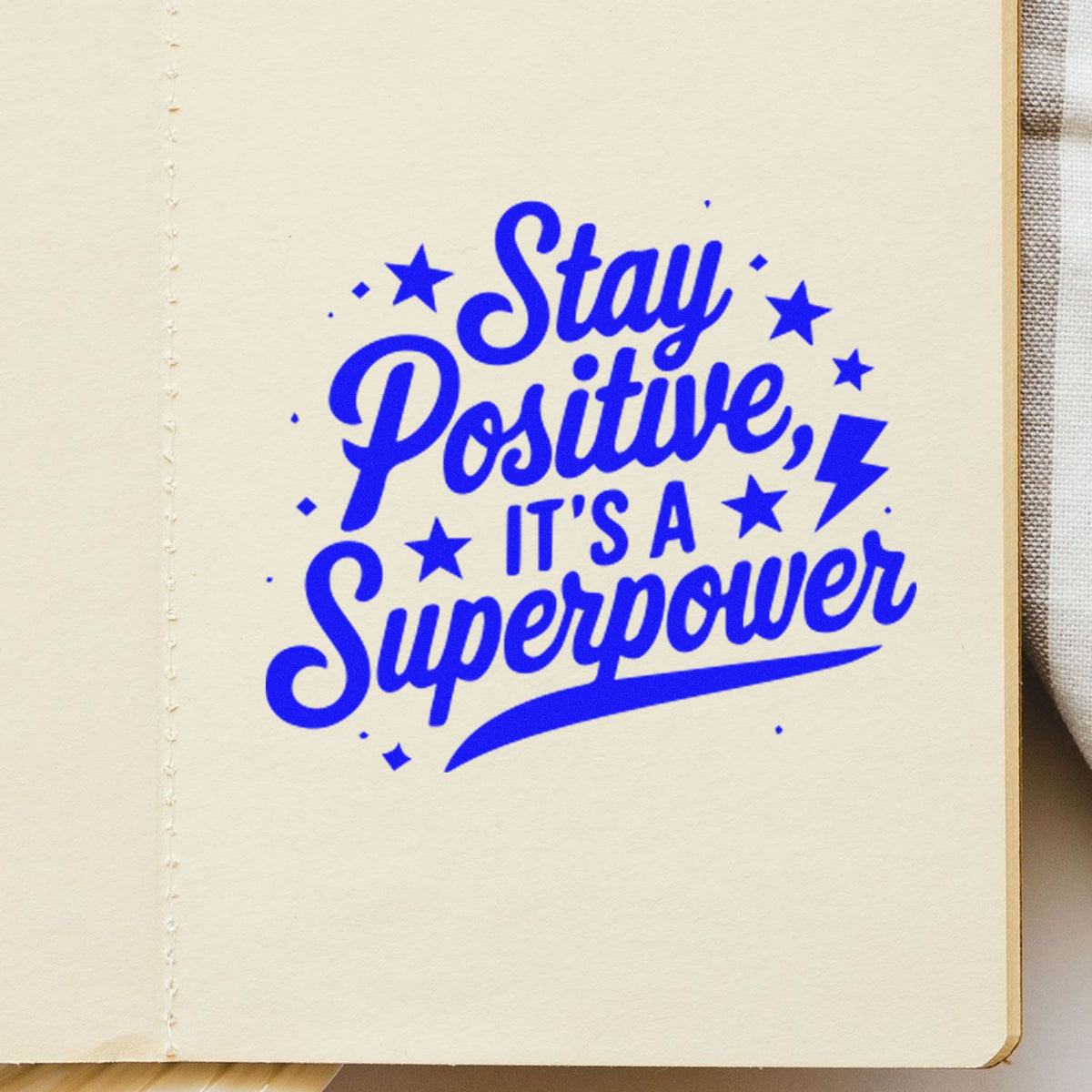 Motivational rubber stamp reading Stay Positive, Its a Superpower for journaling, scrapbooking, and craft projects.