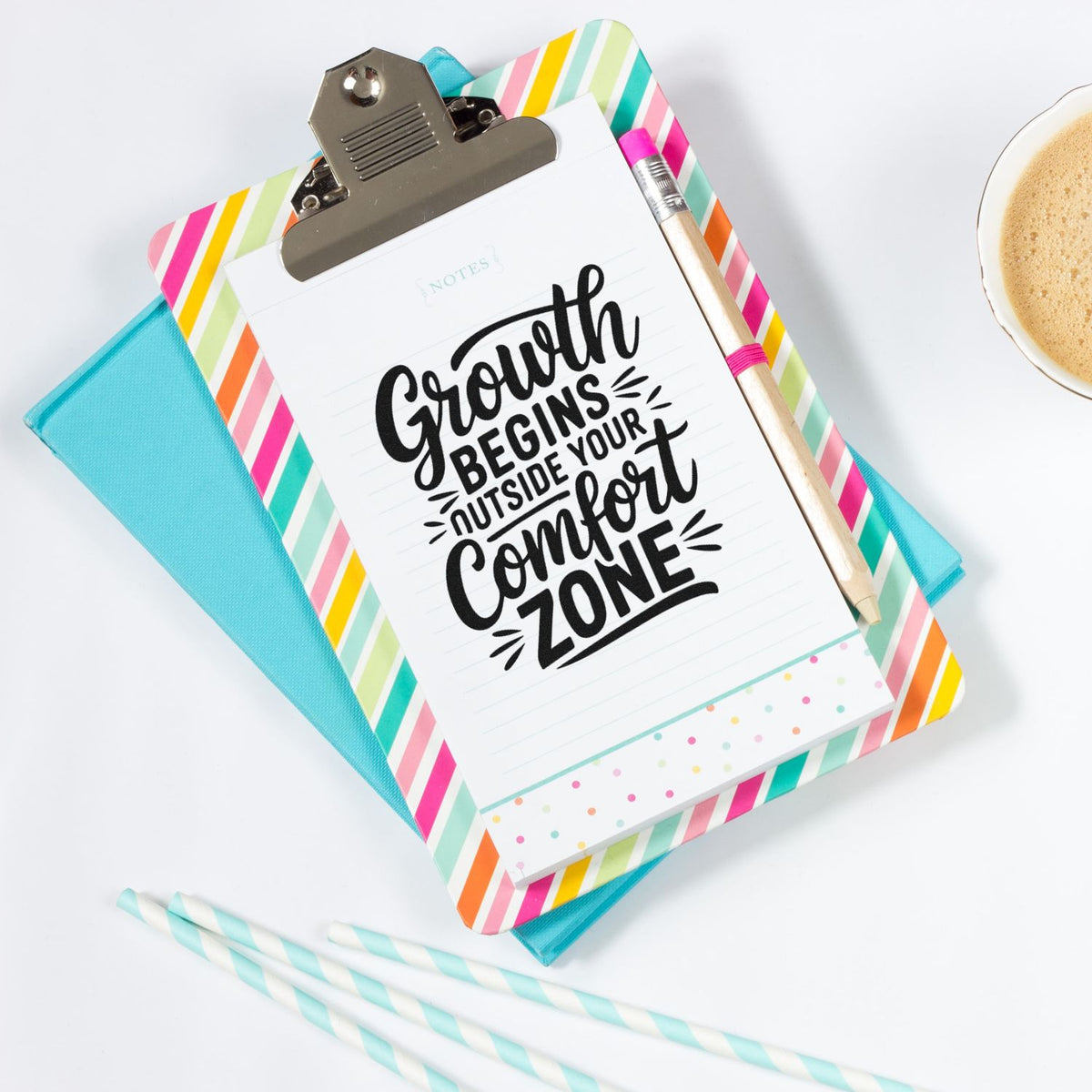 Inspirational rubber stamp design with Growth begins outside your comfort zone on a colorful clipboard for journaling and planners.