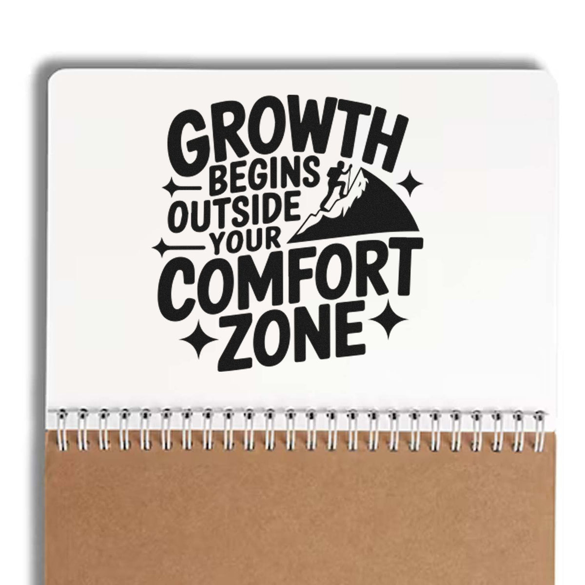 Motivational rubber stamp design reading Growth Begins Outside Your Comfort Zone with mountain climber graphic.