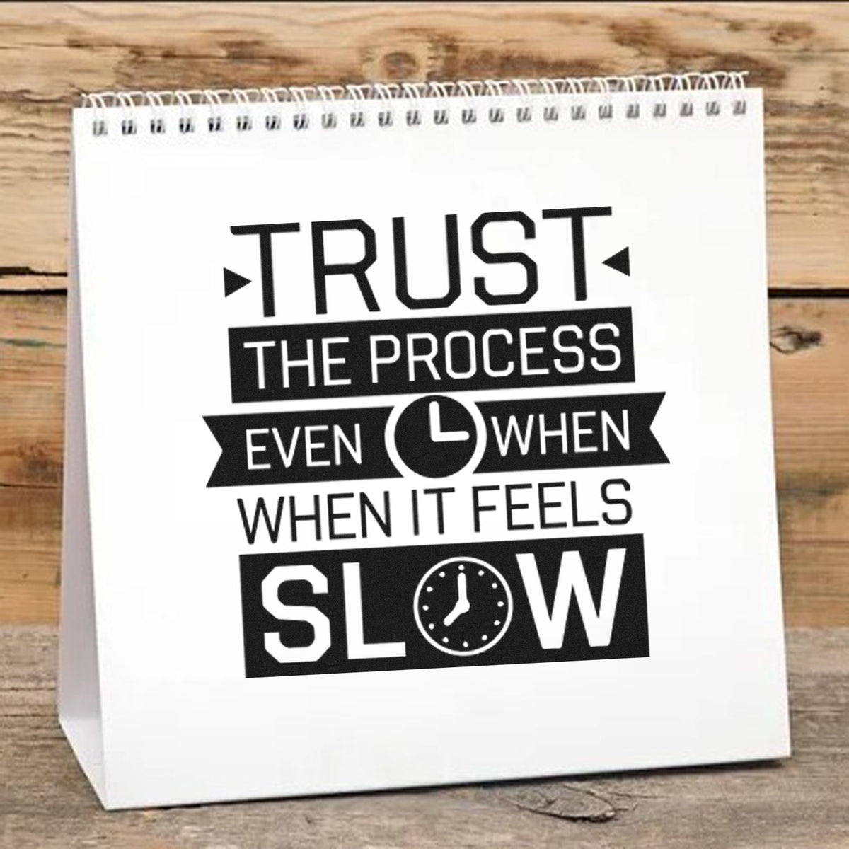 Rubber stamp design on gift bag reading Trust the process even when it feels slow with clock icon for motivational crafting.