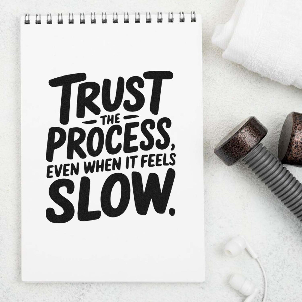 Rubber stamp design with motivational quote Trust the process, even when it feels slow on a notebook page.