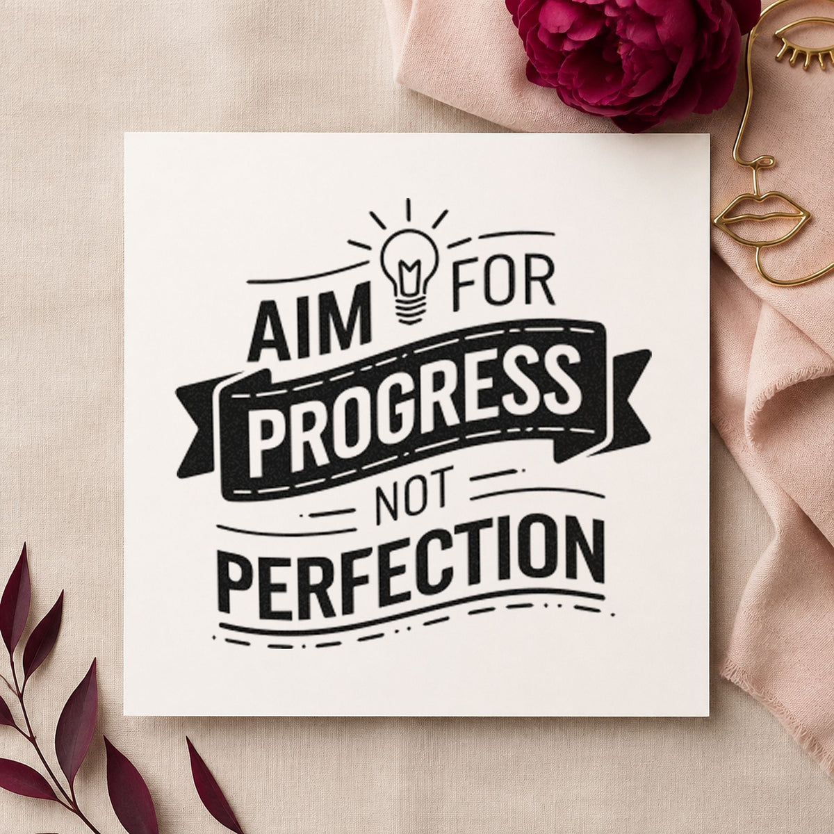 Aim Progress Not Perfection rubber stamp printed in black ink, ready for daily line sheet and similar paper crafts.
