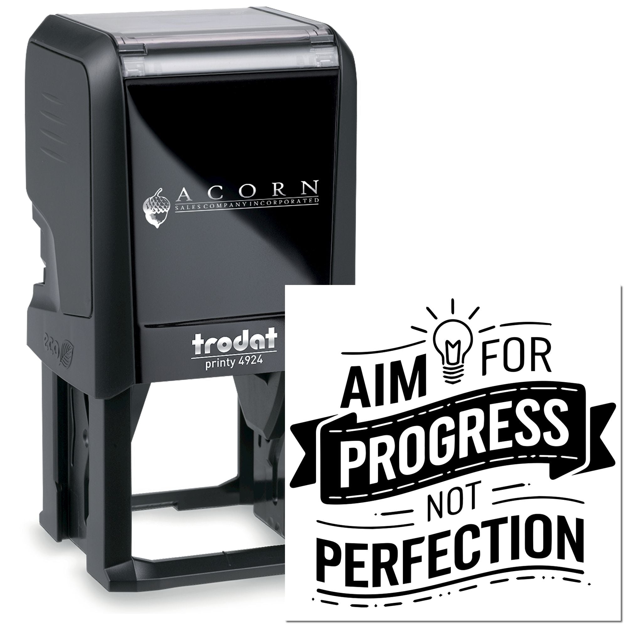 Custom self-inking rubber stamp with Aim for progress not perfection motivational quote for office branding.