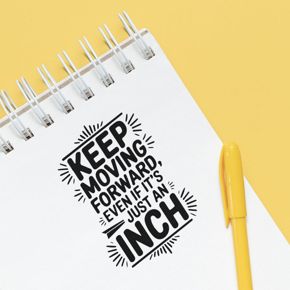 Motivational rubber stamp design reading Keep moving forward, even if its just an inch on a notebook with yellow pen.