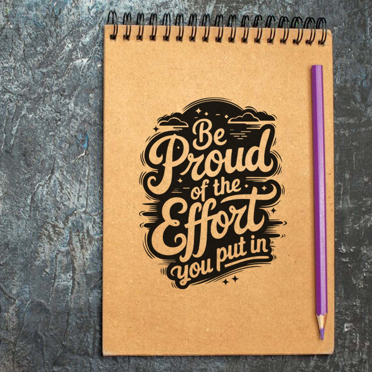 Custom rubber stamp on notebook with motivational quote, Be Proud of the Effort you put in.