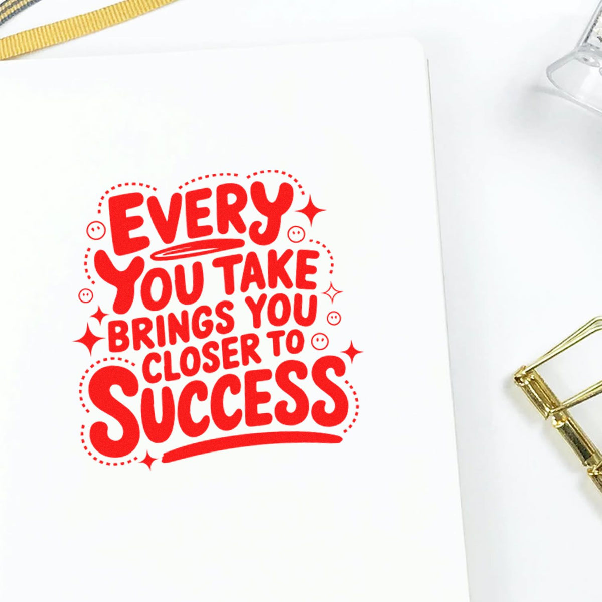Red motivational rubber stamp impression with success quote for planners, journals, and handmade cards.