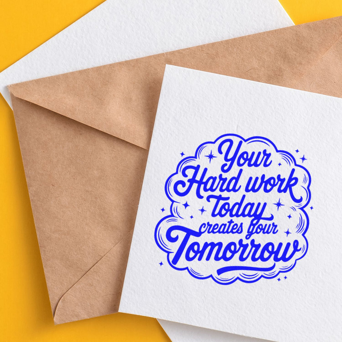Hard Work Creates Tomorrow rubber stamp shown in blue ink, stamped for projects such as college album page.