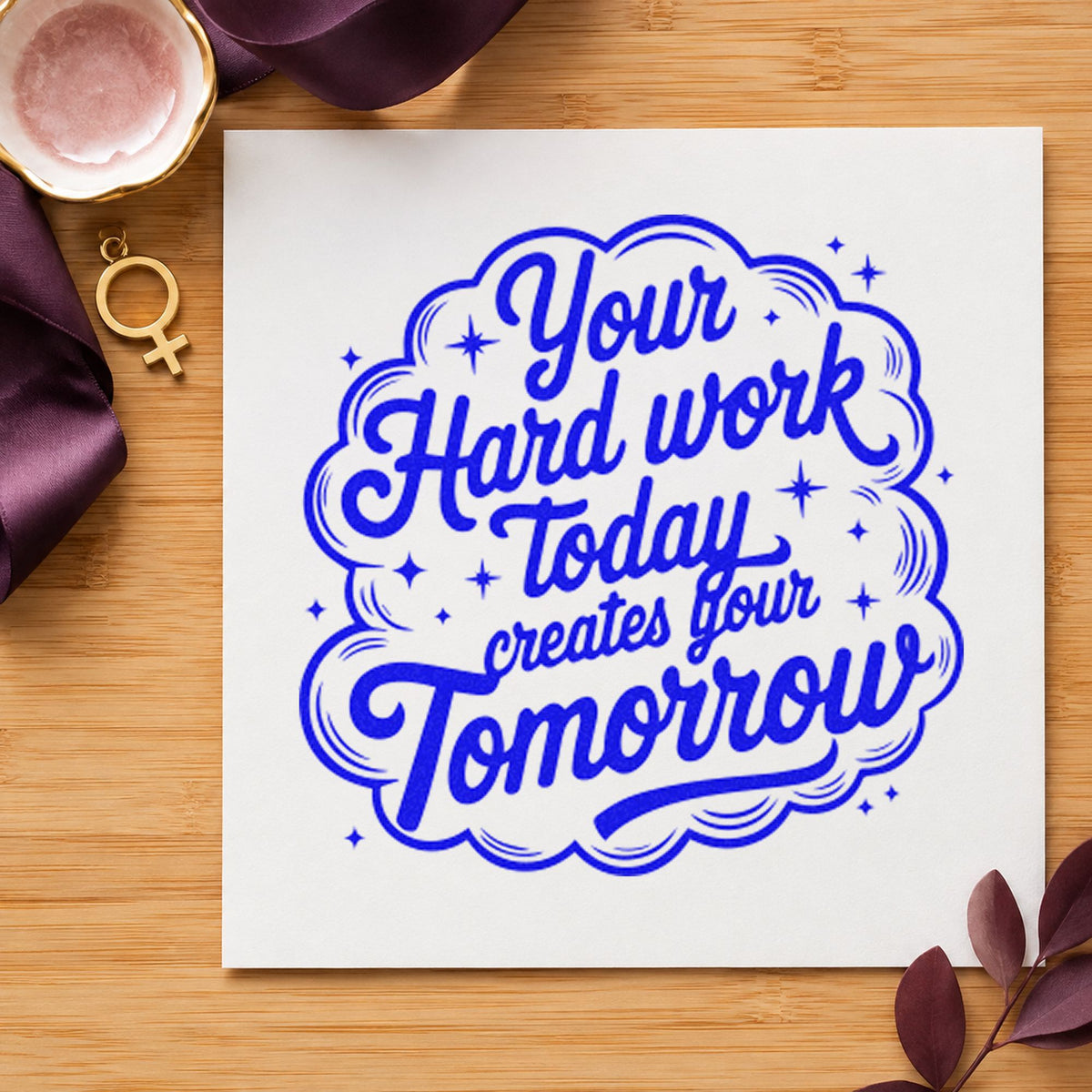 Hard Work Creates Tomorrow craft stamp imprinted in blue ink on paper, a design suited to framed dorm desk.