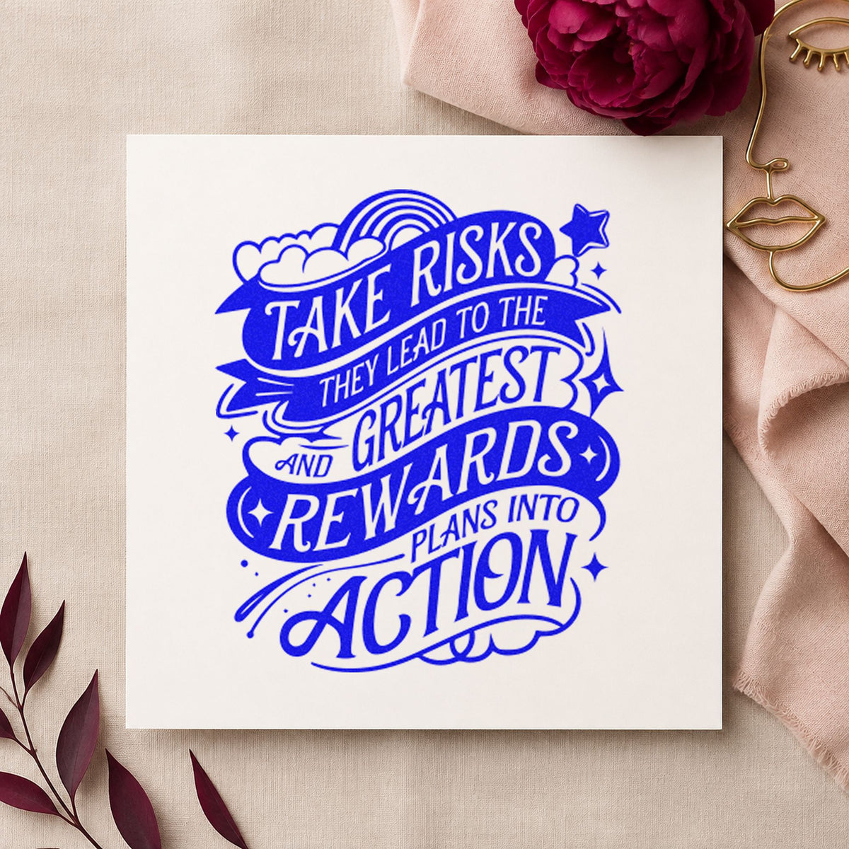 Take Risks Greatest Rewards craft stamp imprinted in blue ink on paper, a design suited to framed work room.