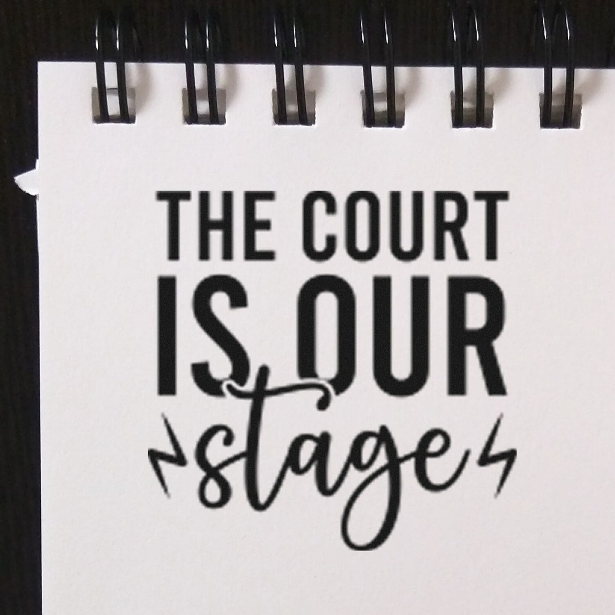 Custom rubber stamp reading The Court Is Our Stage for basketball coaches, teams, and sports events