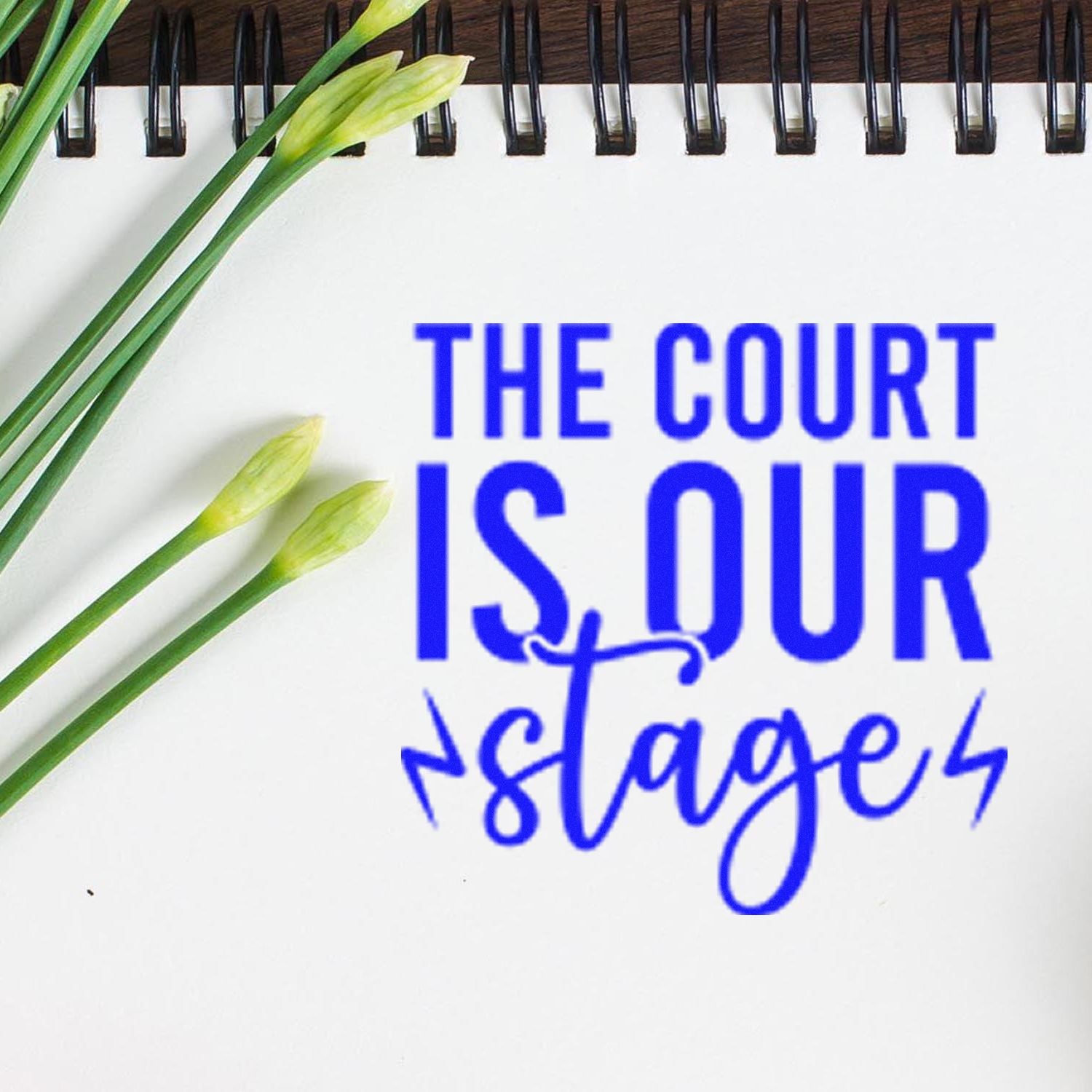 Custom rubber stamp reading The Court Is Our Stage for legal, tennis, or motivational branding.