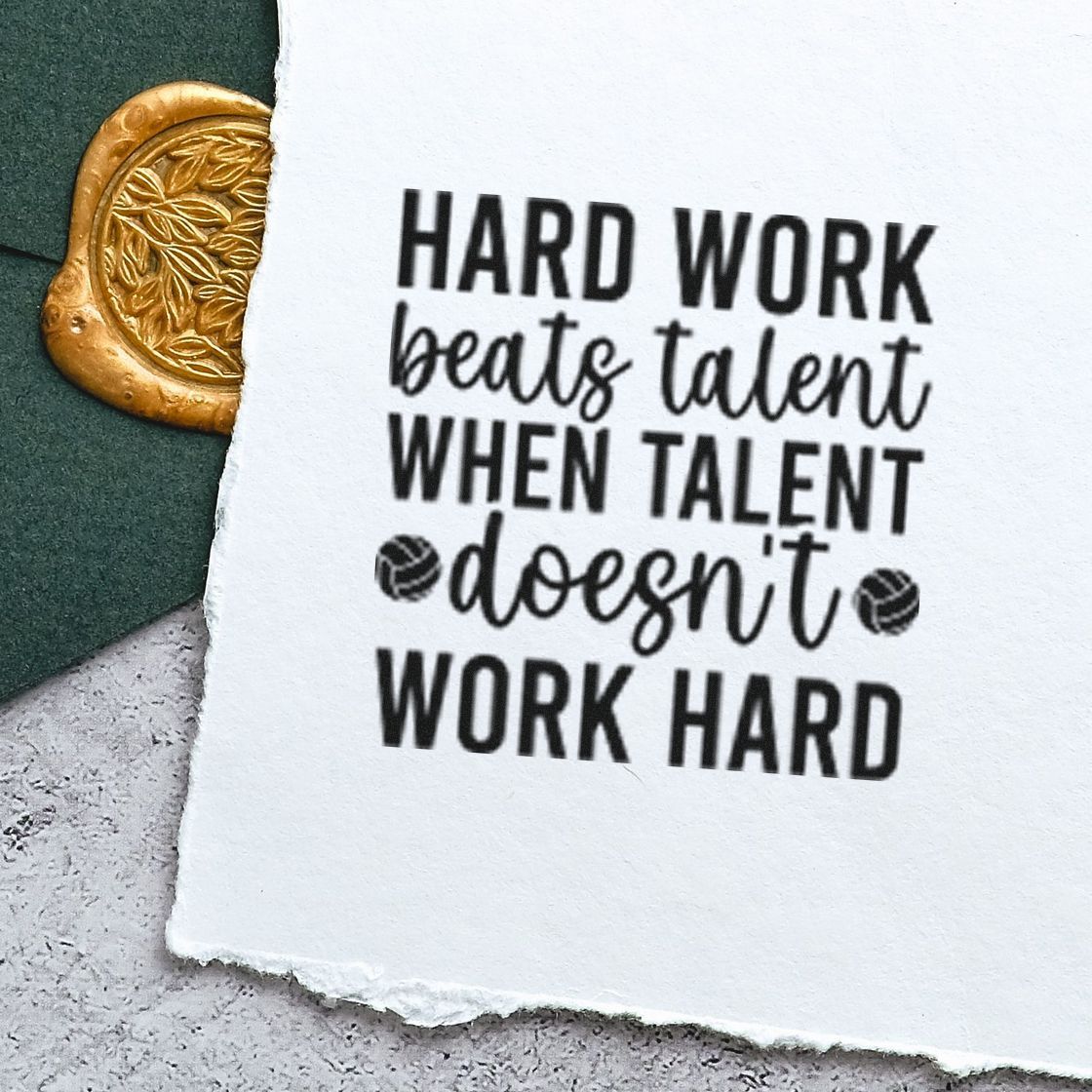 Motivational rubber stamp impression reading Hard work beats talent when talent doesnt work hard on handmade paper.