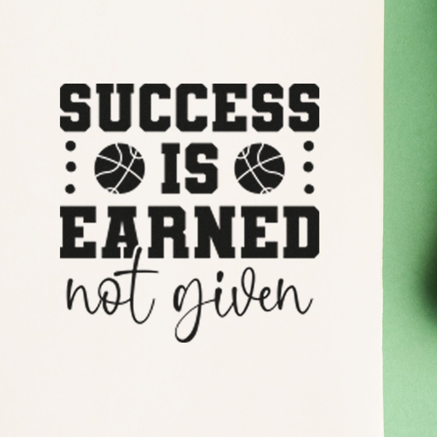 Basketball rubber stamp with motivational quote, Success is earned, not given, in bold black text.