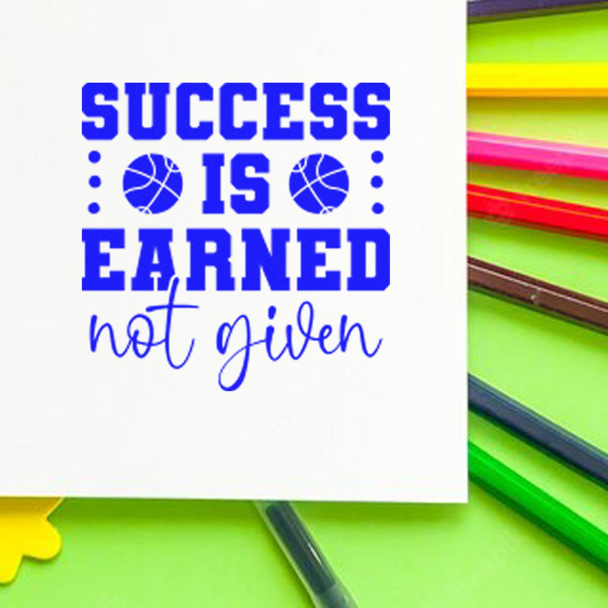 Custom rubber stamp design with basketball graphics and phrase Success is earned, not given for sports motivation.