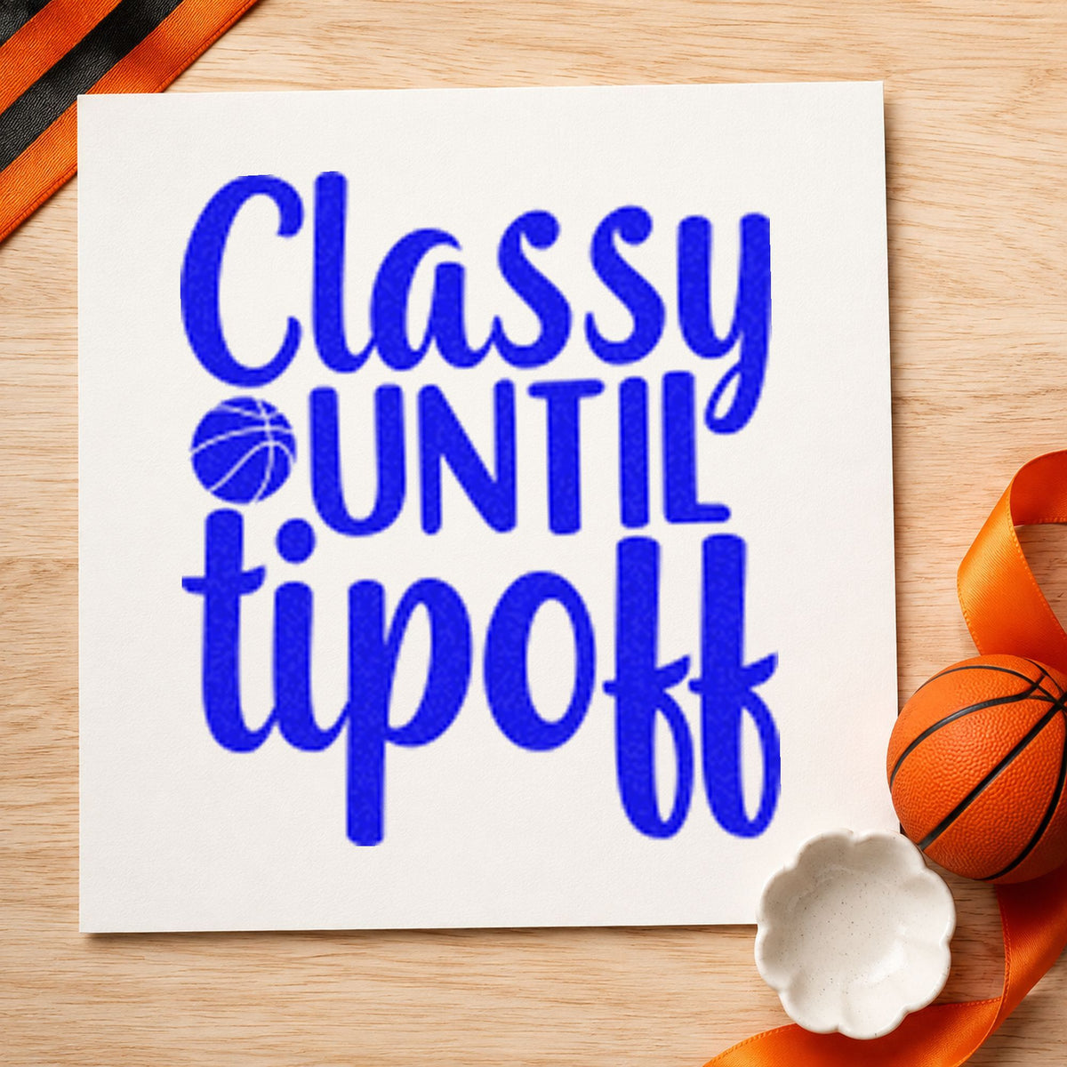 Classy Until Tipoff Basketball craft stamp imprinted in blue ink on paper, a design suited to framed vanity corner.