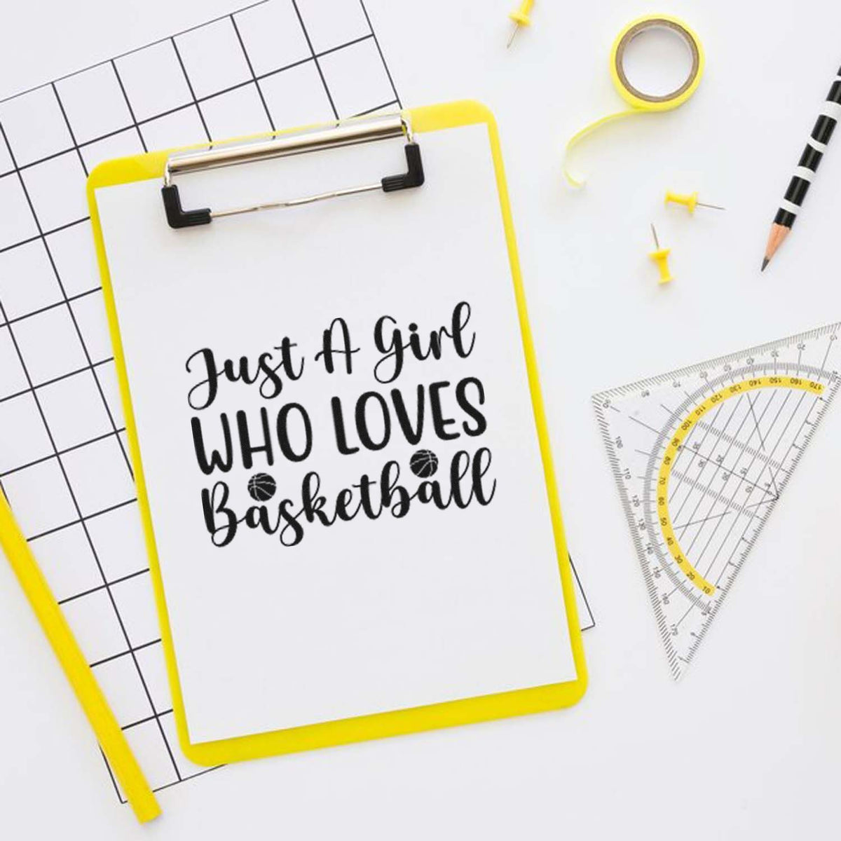 Personalized basketball rubber stamp design reading Just a Girl Who Loves Basketball on a clipboard with stationery.