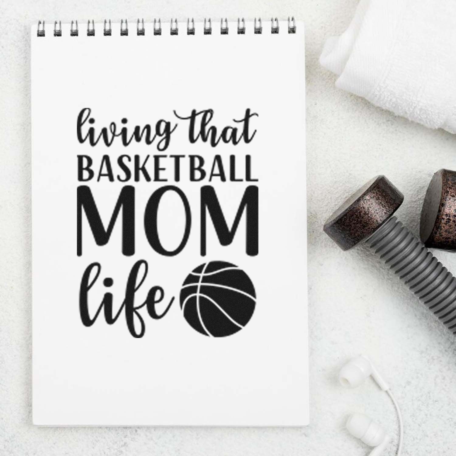 Basketball mom rubber stamp design on notebook, reading living that basketball mom life with a basketball icon.
